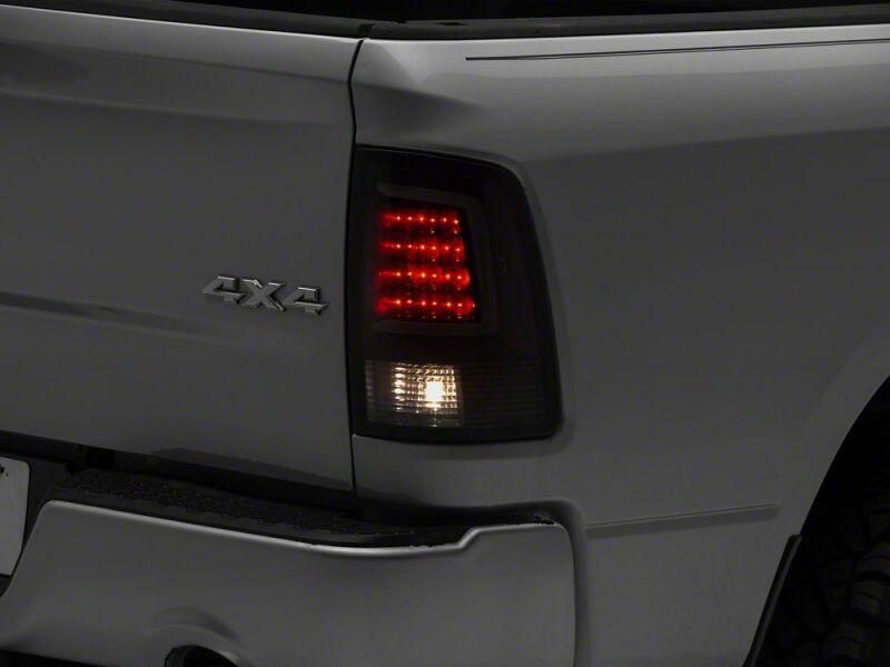 Raxiom 09-18 Dodge RAM 1500 Axial Series LED Tail Lights- Black Housing- Smoked Lens