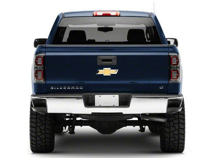 Raxiom 14-18 Chevrolet Silverado 1500 LED Tail Lights/SeqTurn Signals- Chrome- Smoked Lens