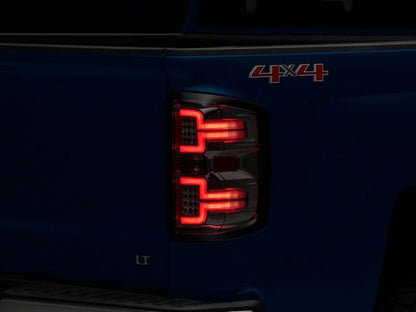 Raxiom 14-18 Chevrolet Silverado 1500 LED Tail Lights/SeqTurn Signals- Chrome- Smoked Lens