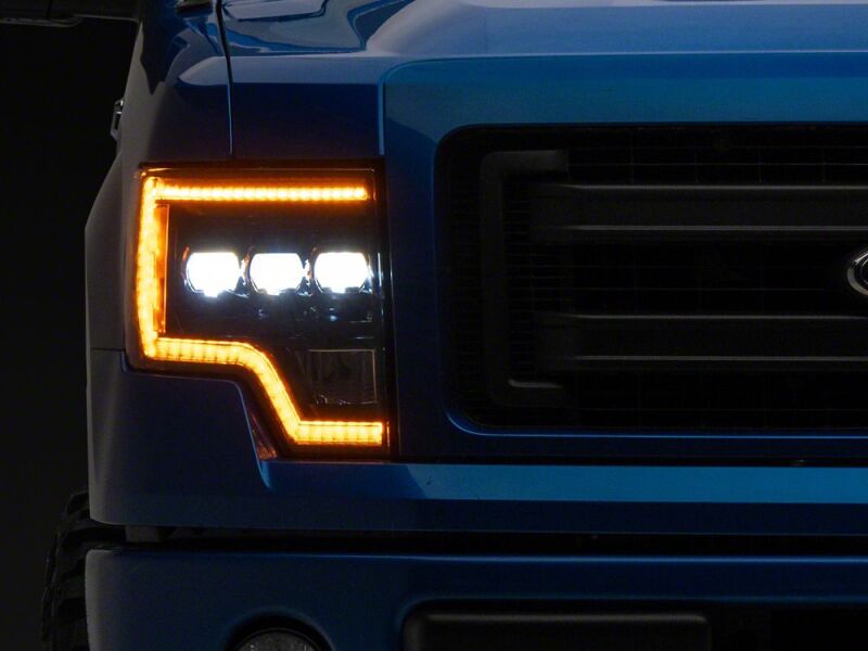 Raxiom 09-14 Ford F-150 CXR Series LED Headlights with Amber DRL- Black Housing- Clear Lens