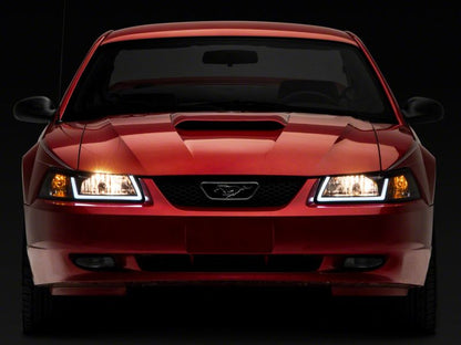Raxiom 99-04 Ford Mustang Axial Series Headlights w/ LED Bar- Black Housing (Clear Lens)
