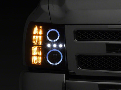 Raxiom 07-13 Chevrolet Silverado 1500 LED Halo Projector Headlights- Black Housing- Clear Lens