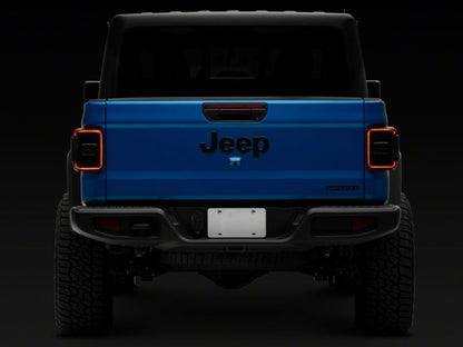 Raxiom 20-23 Jeep Gladiator JT w/ Factory Halogen LED Tail Lights- Black Housing (Smoked Lens)