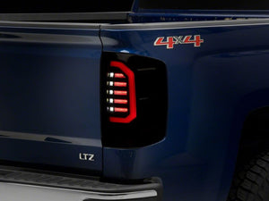 Raxiom 14-18 Chevrolet Silverado 1500 Axial Series LED Tail Lights- Blk Housing (Smoked Lens)