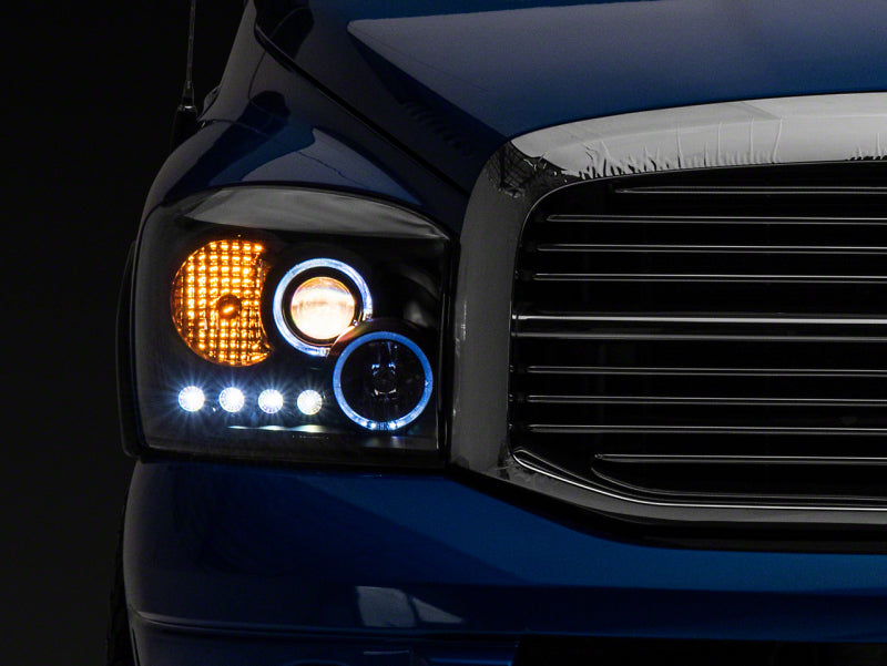 Raxiom 06-08 Dodge RAM 1500 LED Halo Projector Headlights- Black Housing (Clear Lens)