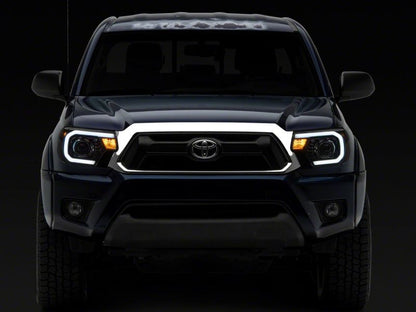 Raxiom 12-15 Toyota Tacoma Axial Series Projector Headlights w/ LED Bar- Black Housing (Clear Lens)