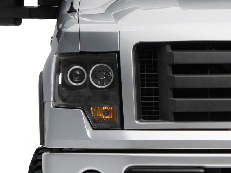 Raxiom 09-14 Ford F-150 Super White LED Halo Projector Headlights- Black Housing (Clear Lens)