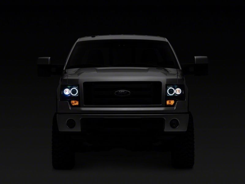 Raxiom 09-14 Ford F-150 Super White LED Halo Projector Headlights- Black Housing (Clear Lens)