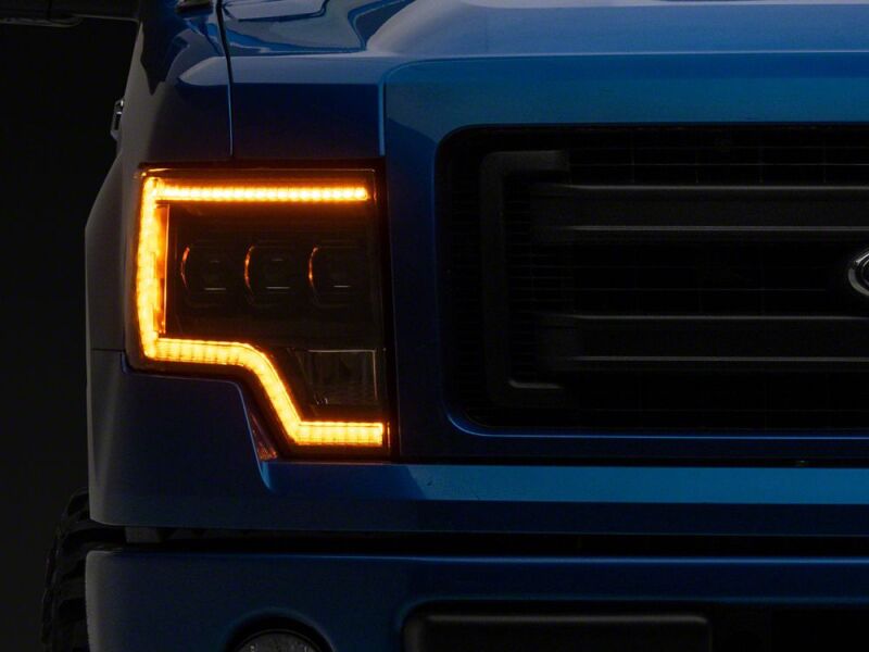 Raxiom 09-14 Ford F-150 CXR Series LED Headlights with Amber DRL- Black Housing- Clear Lens