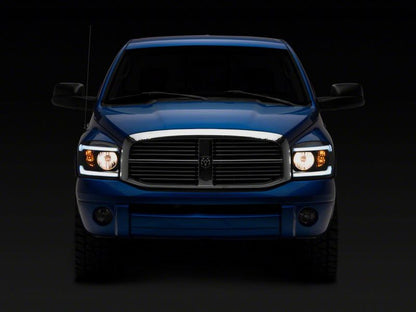 Raxiom 06-09 Dodge RAM 1500/2500/3500 Axial Headlights w/ SEQL LED Bar- Black Housing (Clear Lens)