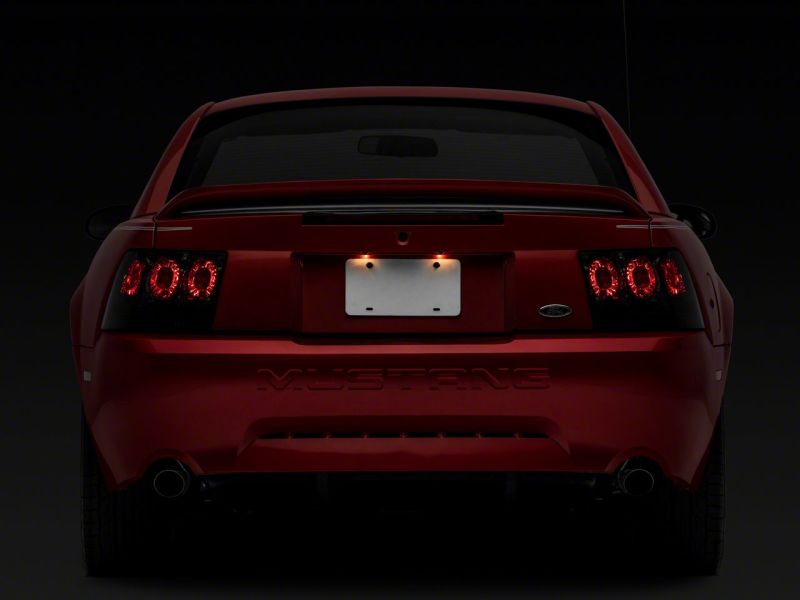Raxiom 99-04 Ford Mustang Axial Series Altezza Style Tail Lights- Black Housing (Smoked Lens)