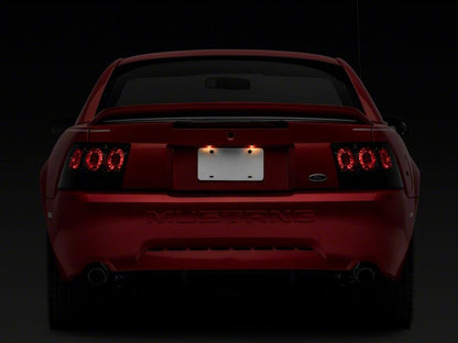 Raxiom 99-04 Ford Mustang Axial Series Altezza Style Tail Lights- Black Housing (Smoked Lens)