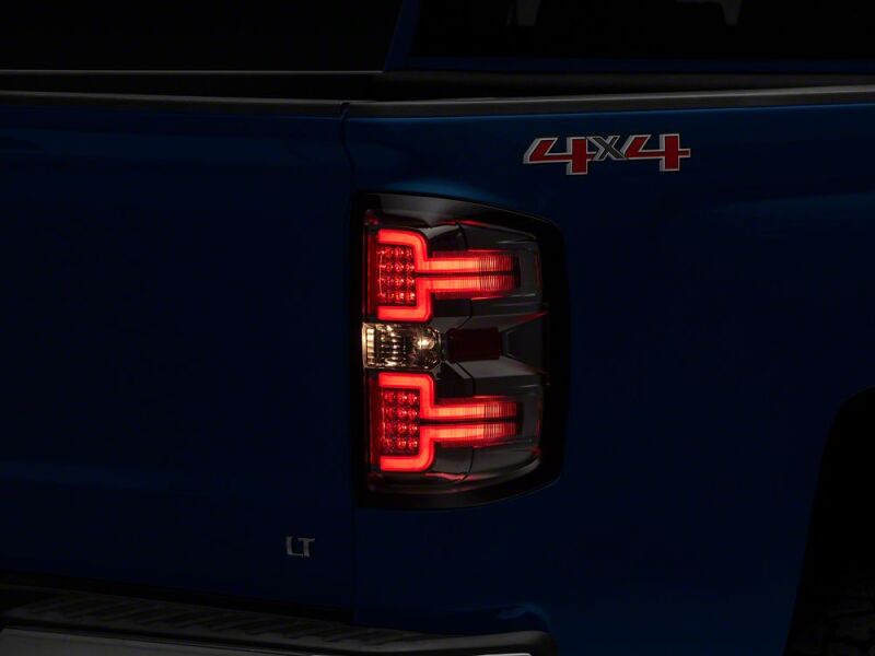 Raxiom 14-18 Chevrolet Silverado 1500 LED Tail Lights/SeqTurn Signals- Chrome- Smoked Lens