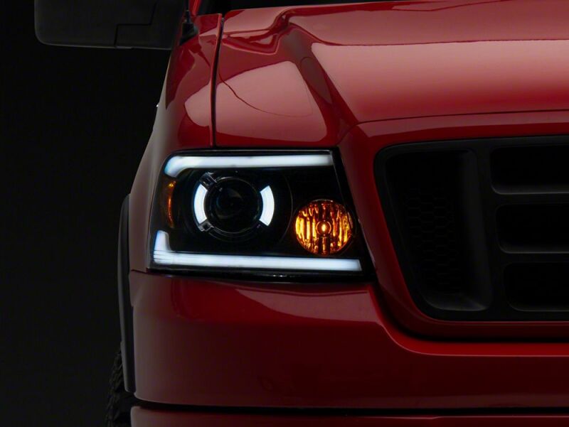 Raxiom 04-08 Ford F-150 Axial Series LED Proj Headlights/Seq LED Bar- Black- Clear Lens