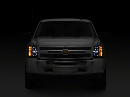 Raxiom 07-13 Chevrolet Silverado 1500 LED Halo Projector Headlights- Black Housing- Clear Lens