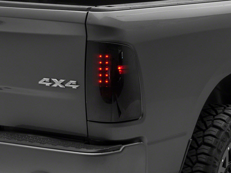 Raxiom 09-18 Dodge RAM 1500/2500/3500 Axial Series LED Tail Lights- Black Housing- Smoked Lens
