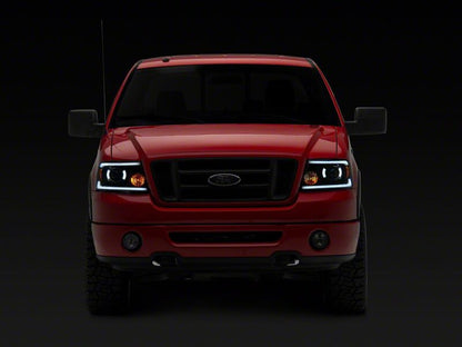Raxiom 04-08 Ford F-150 Axial Series LED Proj Headlights/Seq LED Bar- Black- Clear Lens