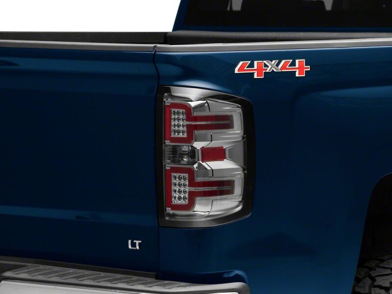 Raxiom 14-18 Chevrolet Silverado 1500 LED Tail Lights/SeqTurn Signals- Chrome- Smoked Lens