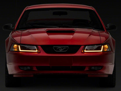 Raxiom 99-04 Ford Mustang Axial Series Headlights w/ Sequential LED Bar- Black Housing (Clear Lens)