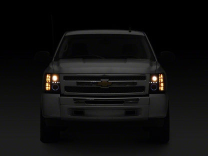 Raxiom 07-13 Chevrolet Silverado 1500 LED Halo Projector Headlights- Black Housing- Clear Lens