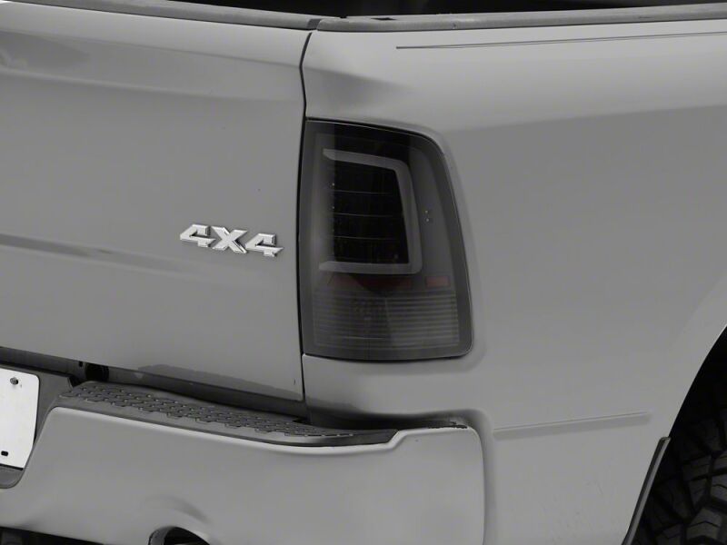 Raxiom 09-18 Dodge RAM 1500 Axial Series LED Tail Lights- Black Housing- Smoked Lens