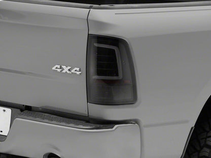 Raxiom 09-18 Dodge RAM 1500 Axial Series LED Tail Lights- Black Housing- Smoked Lens