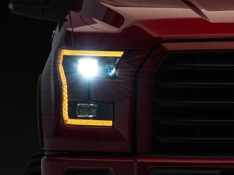 Raxiom 15-17 Ford F-150 LED Projector Headlights with LED Amber DRL- Black Housing- Clear Lens