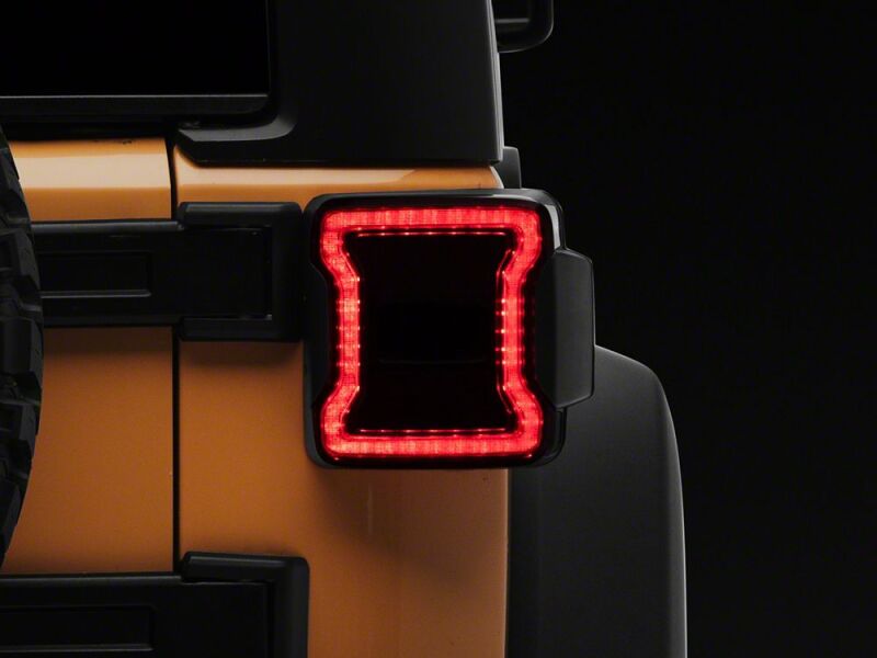 Raxiom 07-18 Jeep Wrangler JK Axial Series JL Style LED Tail Lights- Black Housing- Smoked Lens
