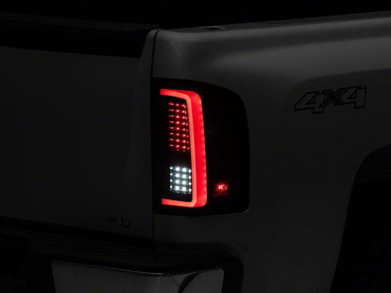 Raxiom 07-13 Chevrolet Silverado 1500 G2 LED Tail Lights- Black Housing- Smoked Lens