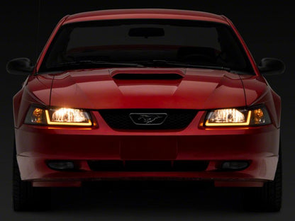 Raxiom 99-04 Ford Mustang Axial Series Headlights w/ Sequential LED Bar- Black Housing (Clear Lens)