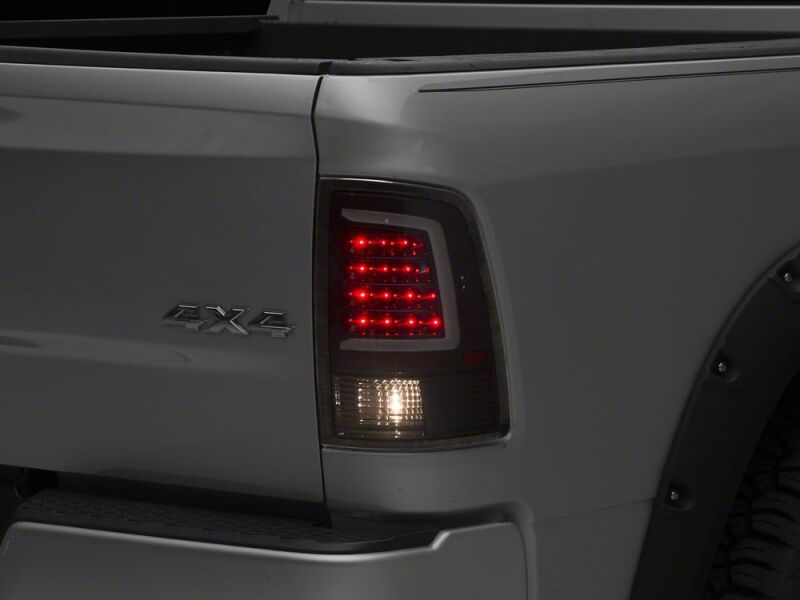 Raxiom 09-18 Dodge RAM 1500 Axial Series LED Tail Lights- Black Housing- Clear Lens