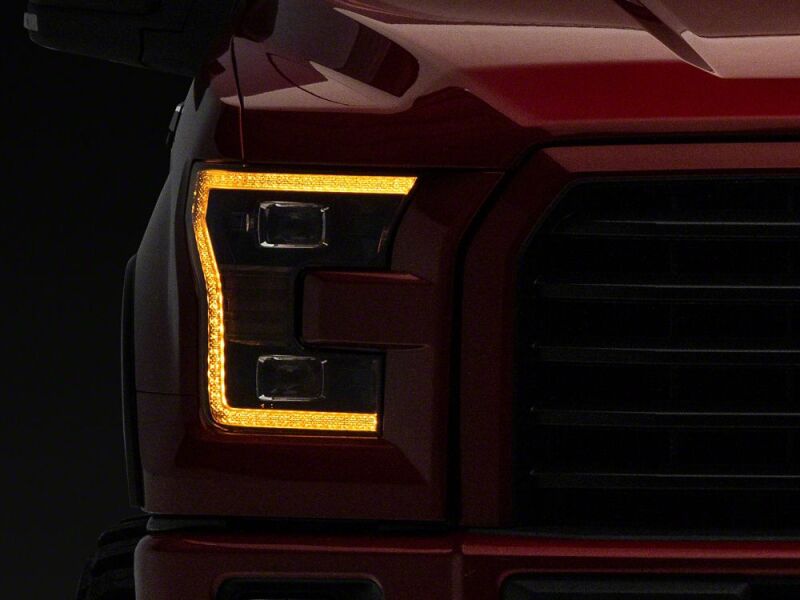 Raxiom 15-17 Ford F-150 LED Projector Headlights with LED Amber DRL- Black Housing- Clear Lens